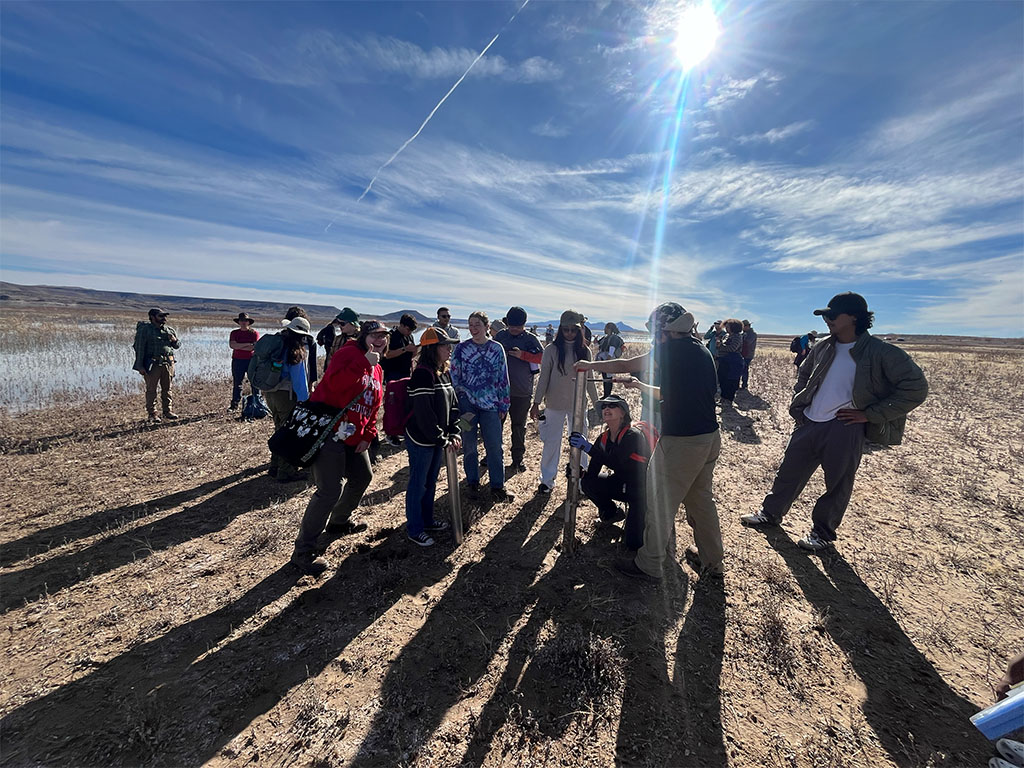 Students gather at a secondary coring site to have hands-on experience with another type of coring equipment. Photo credit: Brandee Carlson
