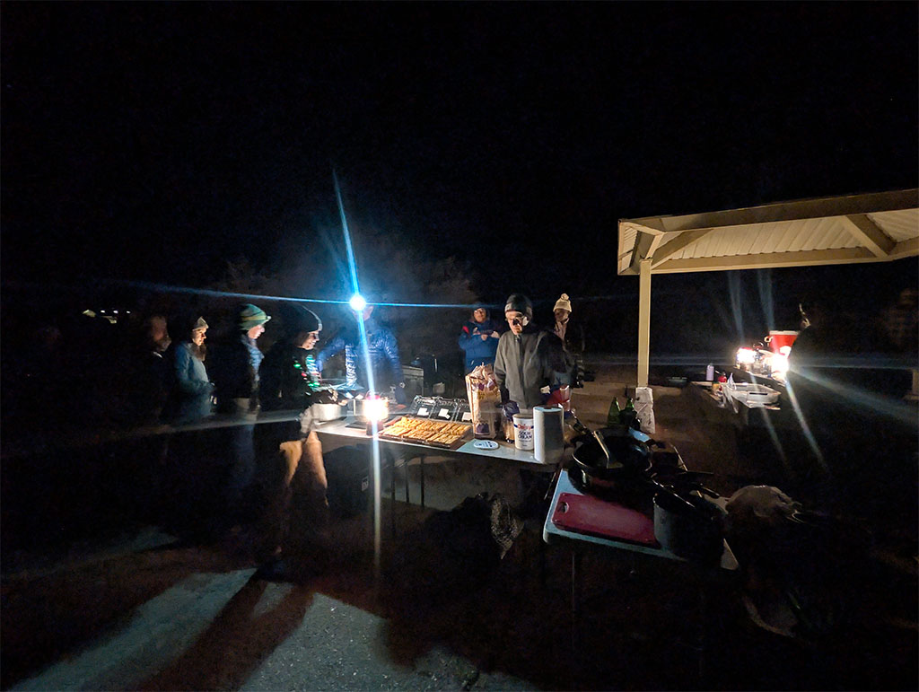 Line eagerly forms to taste the delicious chili and cornbread made by one of our rotating groups. Photo credit: Tommy Tran