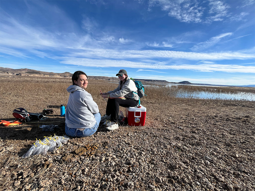  Undergraduate researchers sit with their prize (a lot of samples!) Photo credit: Brandee Carlson