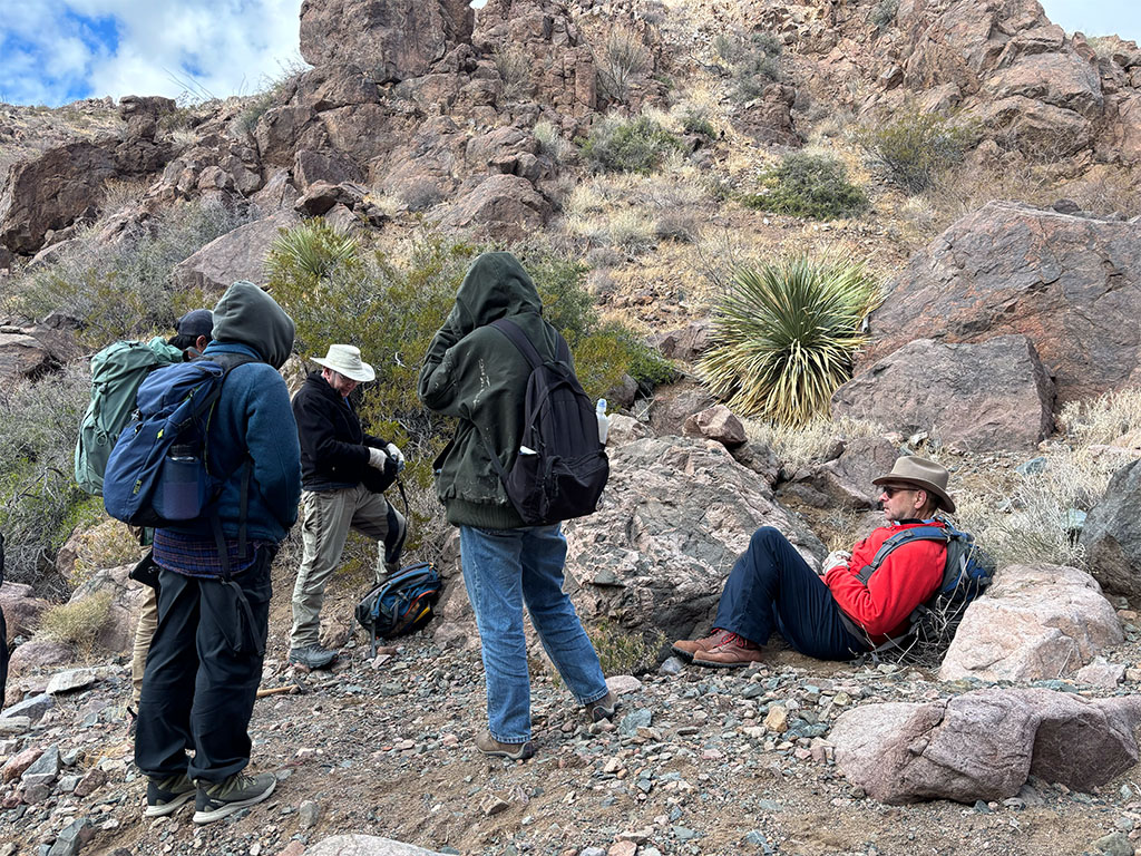 Dr. Pete Copeland and guest lecturer Dr. Tim Lawton taking a rest without stopping the geology lesson. Photo credit: Megan Kroeger