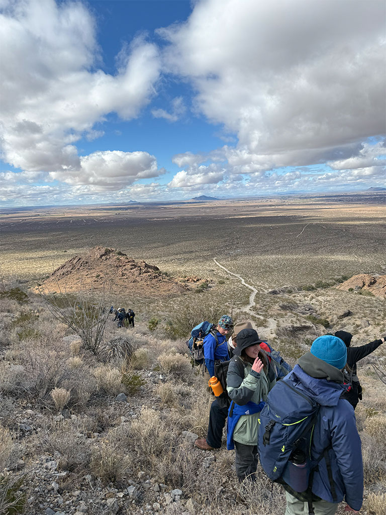 Students climbing old mining prospect and mixed magma field. Photo credit: Leila Hojat