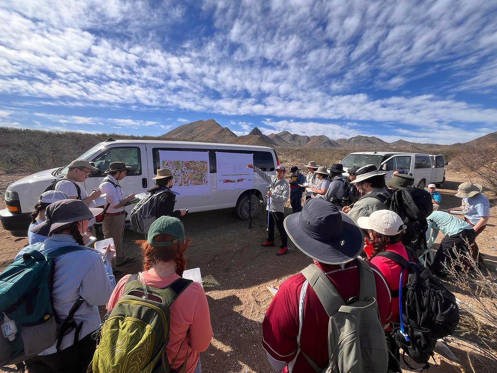 Photo Credit: TA Michael Daniel - Professor Dr. Mike Murphy introducing the students to the geologic units in the field area.