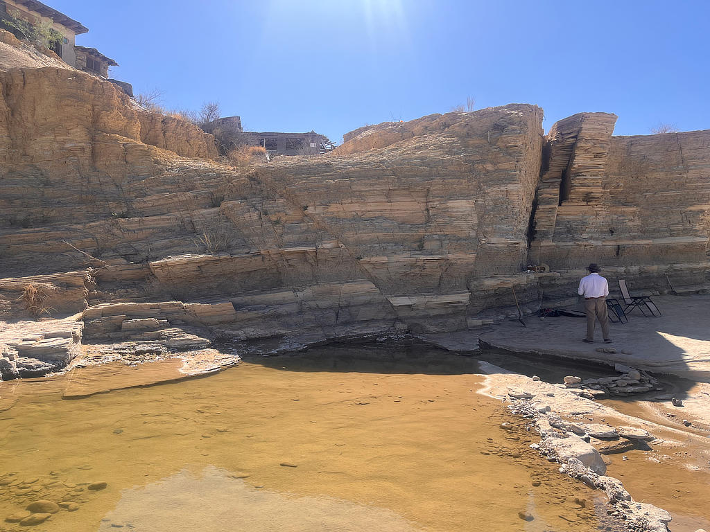 Photo Credit: TA Michael Daniel - Student Mathew Santos hastily makes his way to sketch and take measurements of this textbook example of a graben.