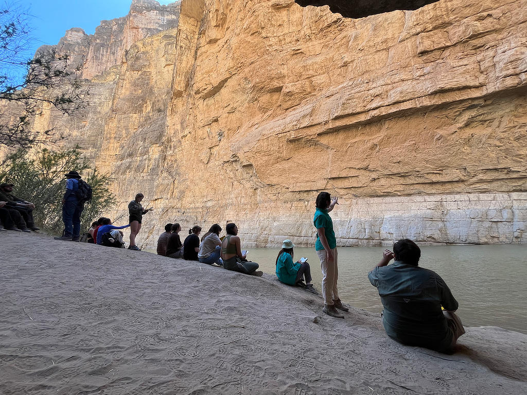 Photo Credit: TA Abe Okayli-Masryk - Graduate Student Syd Lineberry assisting the students through a sketch of the canyon walls after we had hiked down into Santa Elena Canyon.