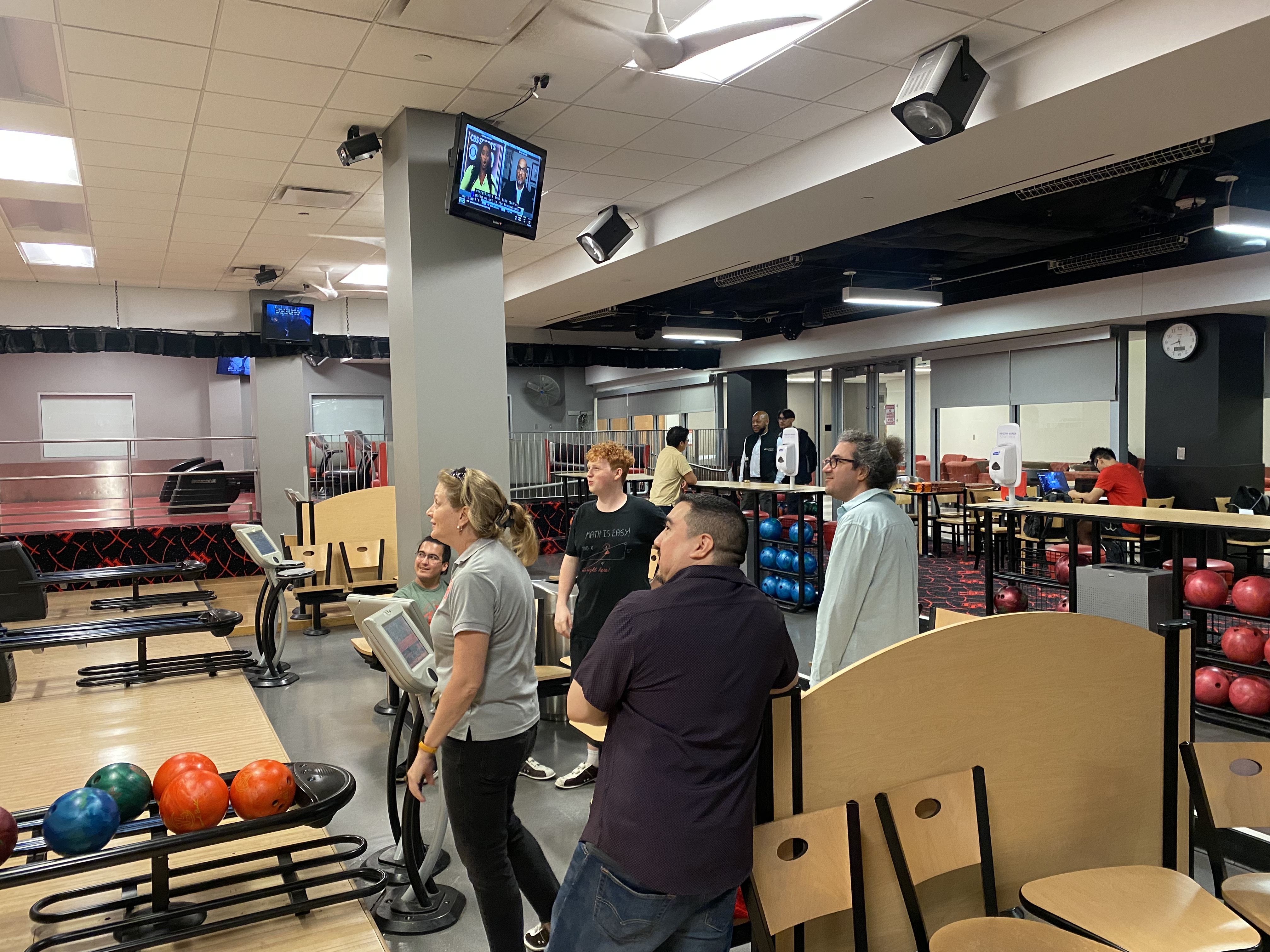 /nsm/math/news-events/stories/2024/uh_usaa_iaba_ambassador_event/gameroom-jen-moses-mehrdad_bowling.jpg