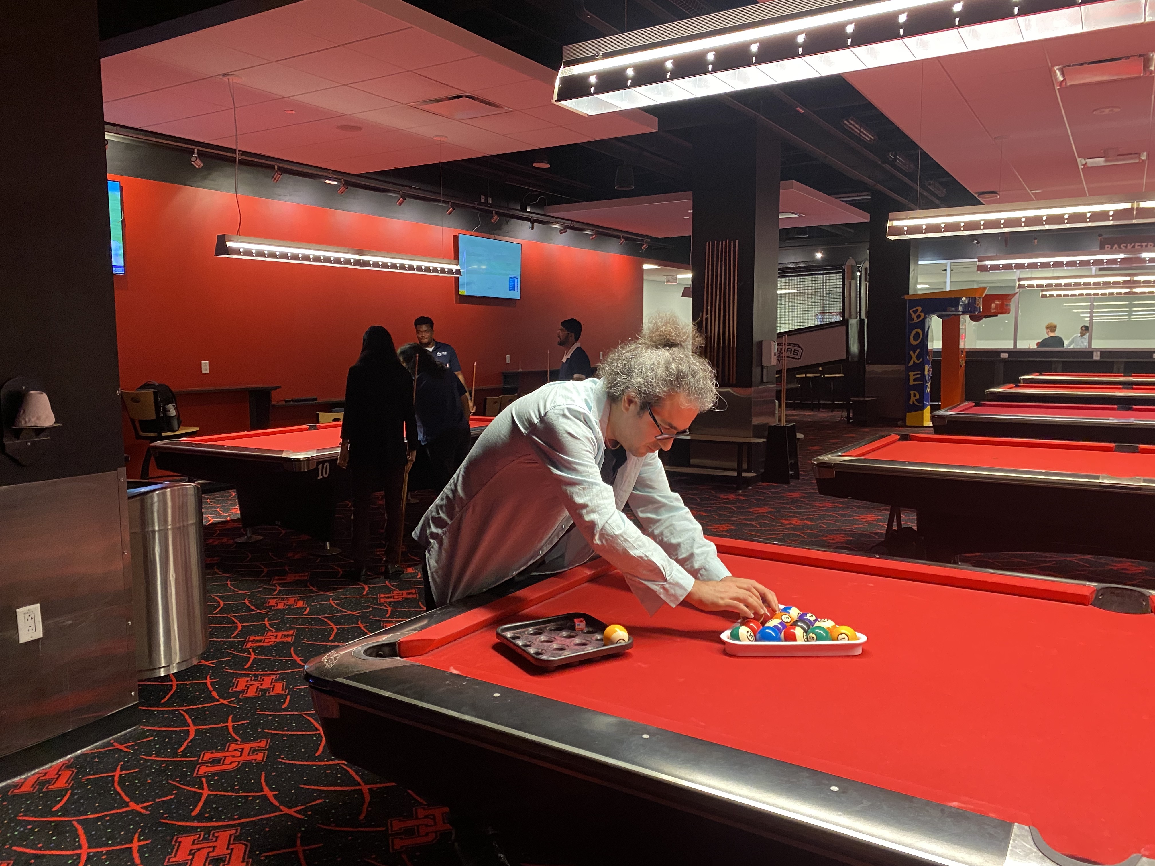 /nsm/math/news-events/stories/2024/uh_usaa_iaba_ambassador_event/gameroom_mehrdad_pool.jpg