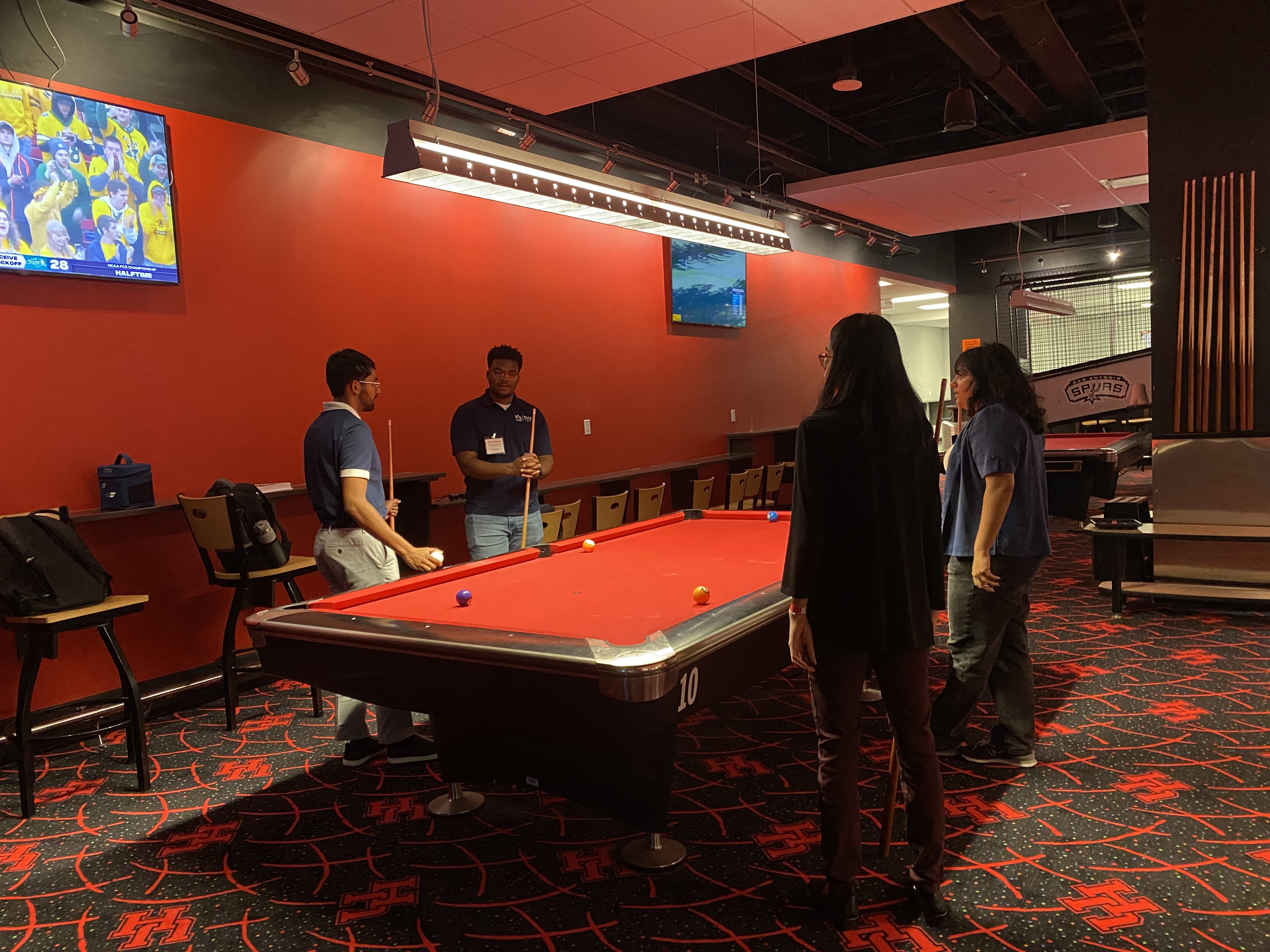 /nsm/math/news-events/stories/2024/uh_usaa_iaba_ambassador_event/gameroom_mufaro-pool.jpg