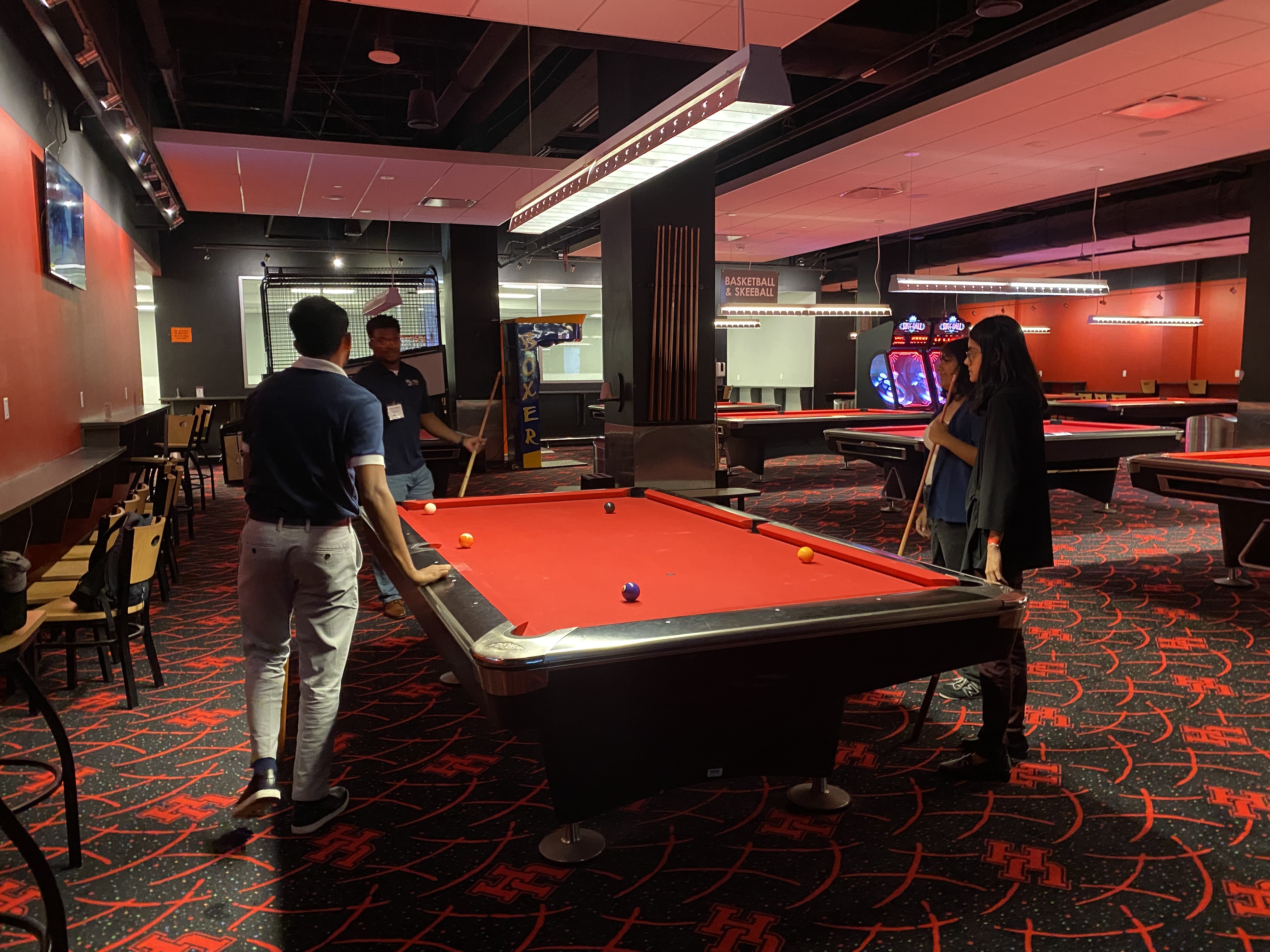 /nsm/math/news-events/stories/2024/uh_usaa_iaba_ambassador_event/gameroom_mufaro-students-pool2.jpg