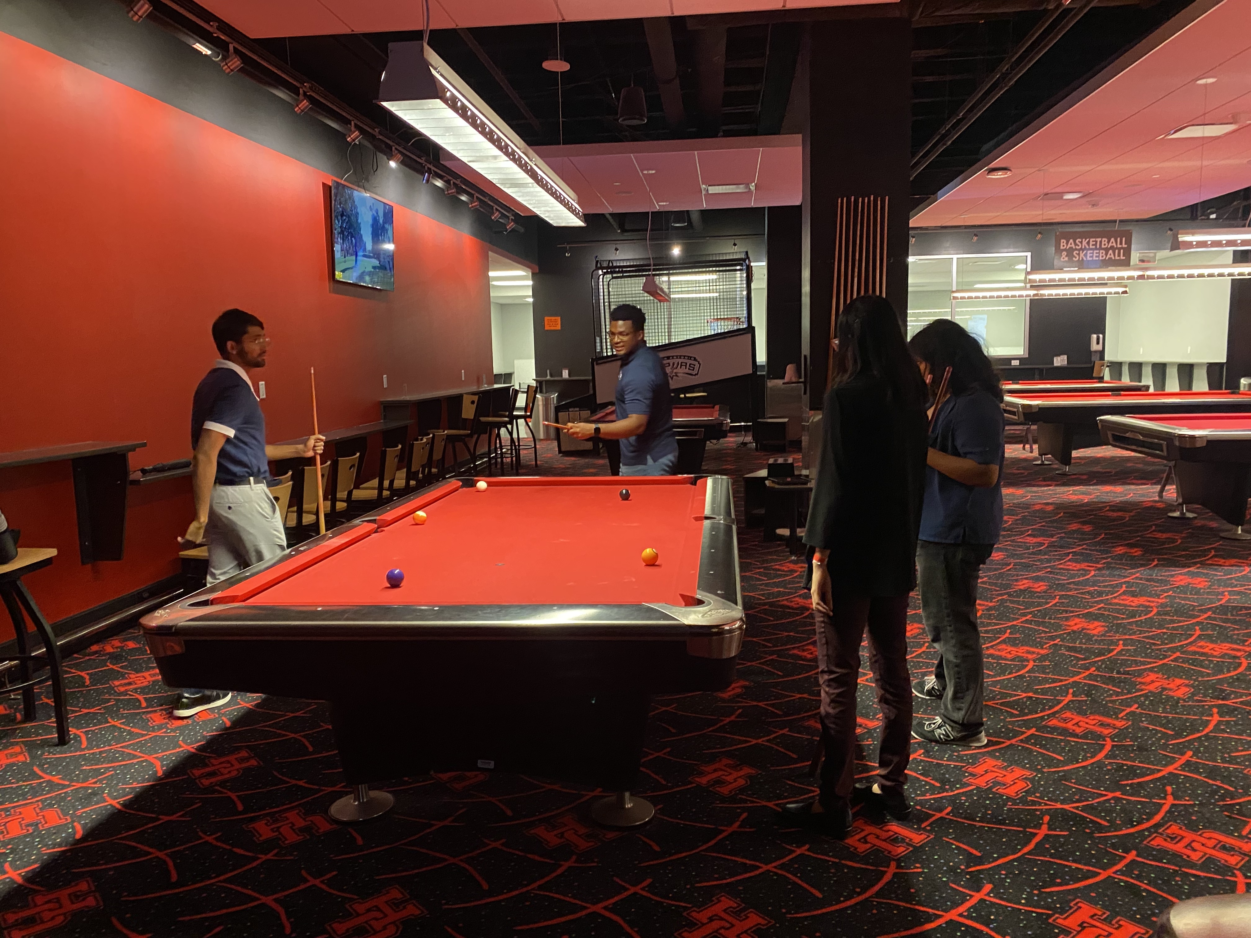 /nsm/math/news-events/stories/2024/uh_usaa_iaba_ambassador_event/gameroom_mufaro-students_pool.jpg