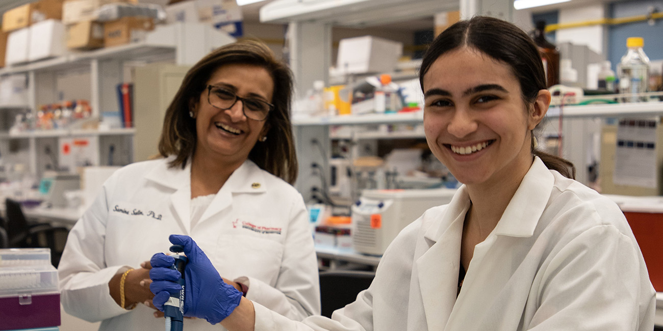Samina and Zamil in the laboratory