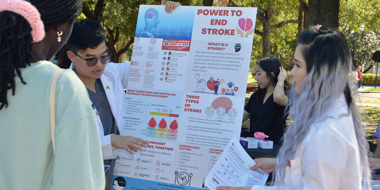 pharmacy students educating student on stroke prevention