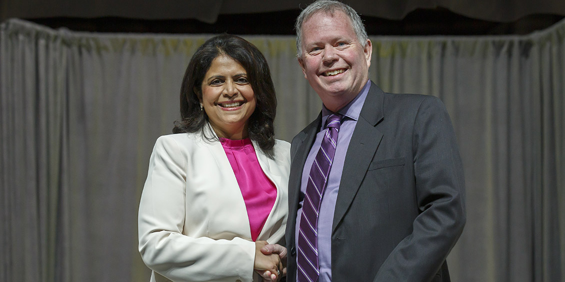 ASHP Foundation Chair Kelly Smith and Garey shaking hands