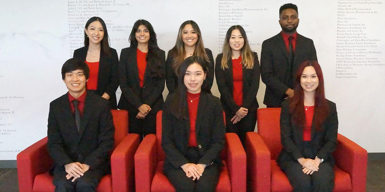 group photo of IPhO chapter members standing and seated