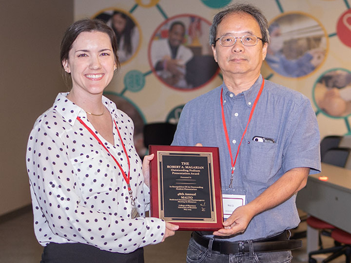 Hartman and Li with award