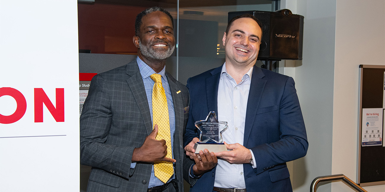 Wucki presenting award to Cox