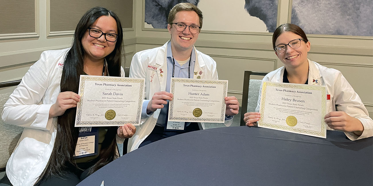 Davis, Adam and Brusen holding certificates