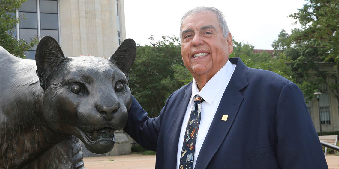 Cuellar at cougar statue