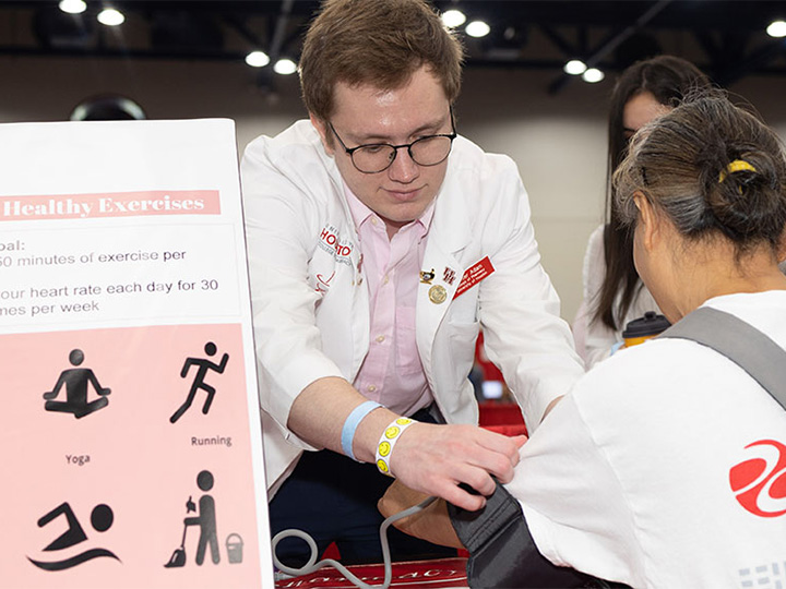 HPSA member gives blood pressure screening