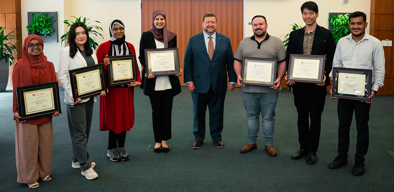 student and post-doc presenters with award and scholar-in-residence