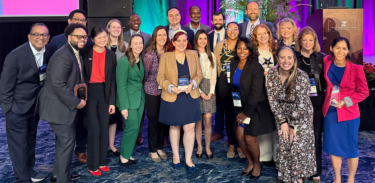Group photo of The Houston Program student/residents, alumni and institutional leaders