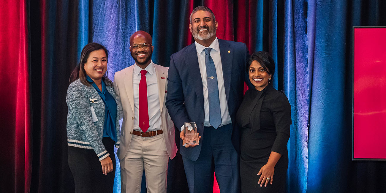 Linda Haines, Alfred Awauah and Divya Varkey present award to Alex Varkey