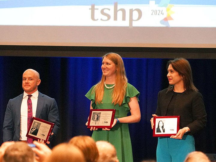 Gessner-Wharton and fellow FTSHP inductees holding plaques 