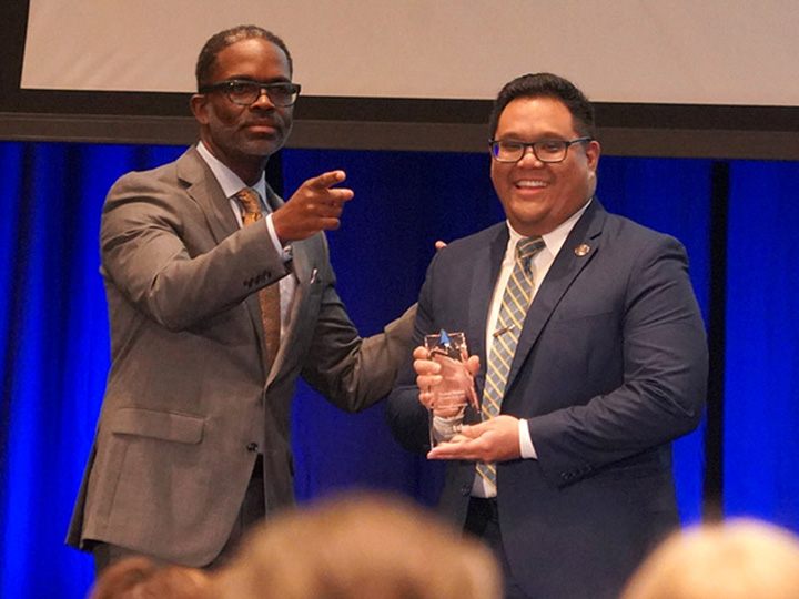 Cox and Roduta with award
