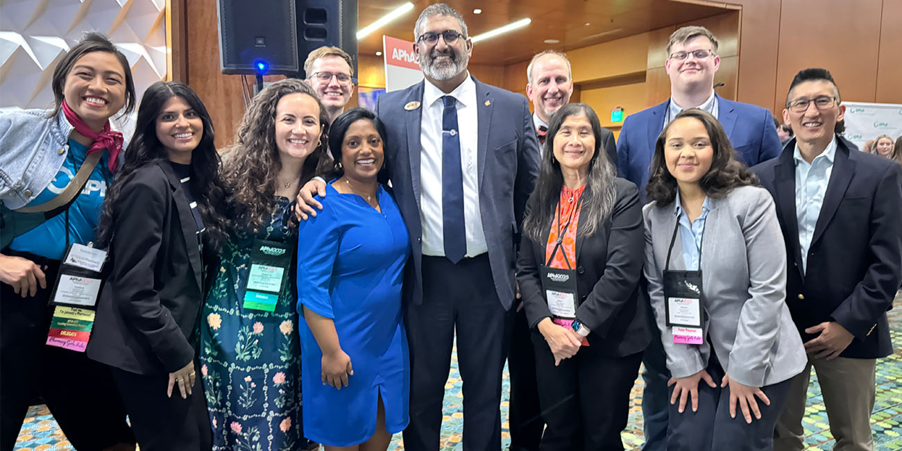 students, alumni and friends in group photo at apha