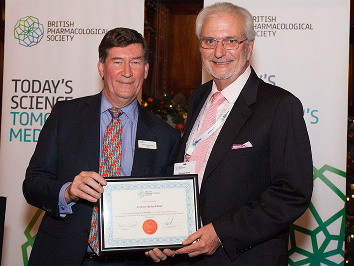 Honfel presenting Bond with award certificate