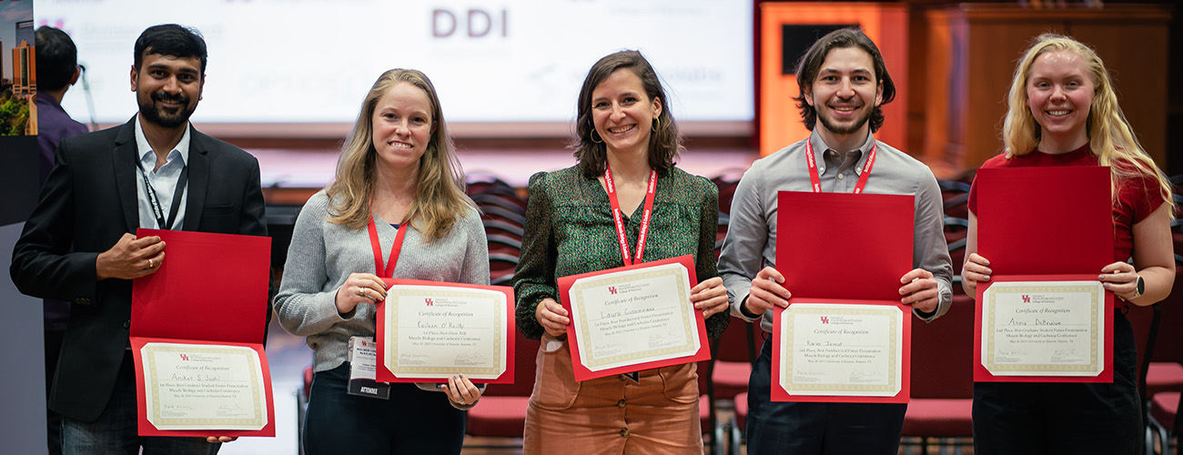 photo of conference awardees with certificates