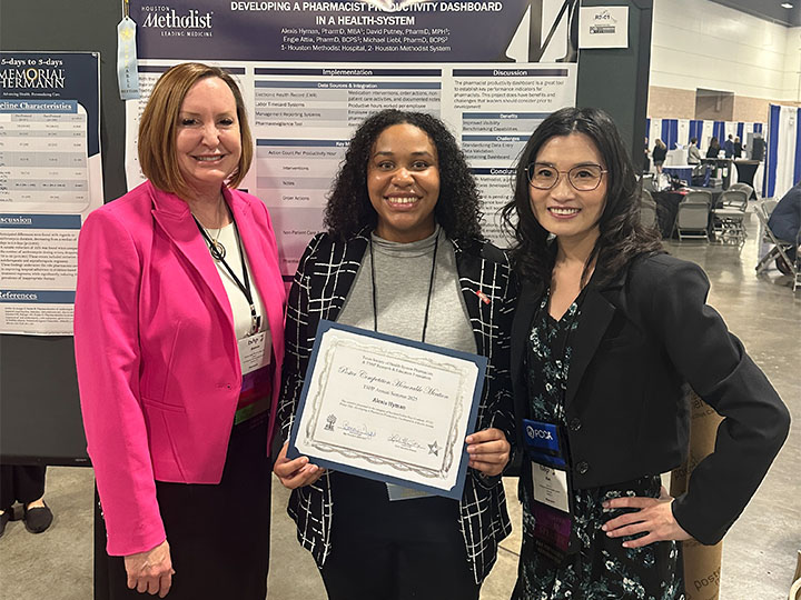 Hyman holding certificate with Dugie and Xu