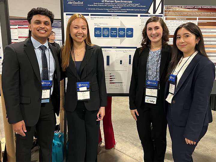 Ninan, Yanga, Esquell and Garcia in front of poster Hyman holding certificate with Dugie and Xu