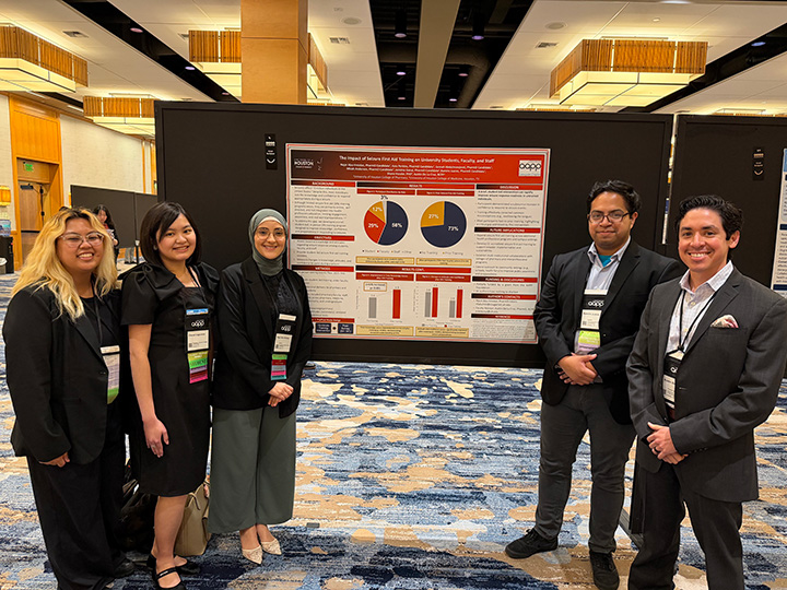 AAPP at National next to poster