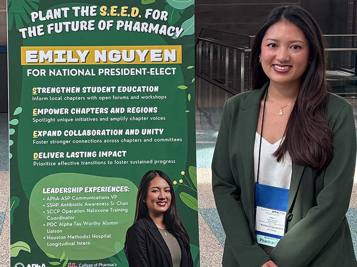 Emily Nguyen with APhA-ASP presidential campaign poster at APhA 2026