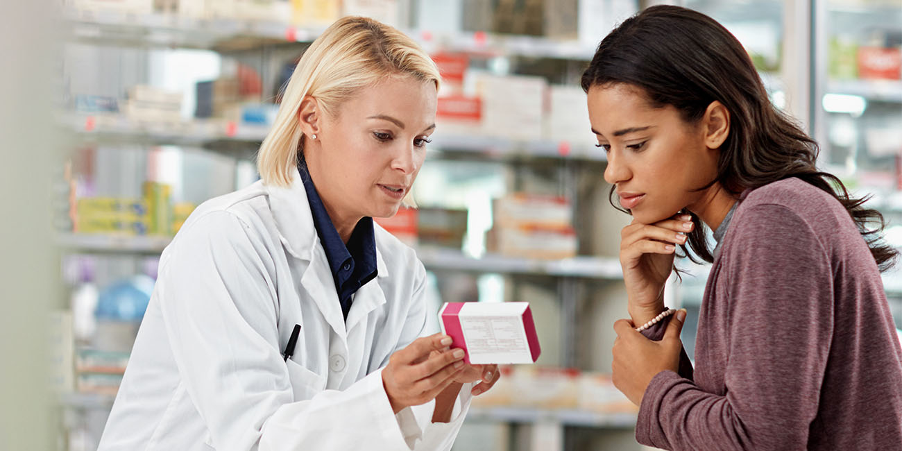 pharmacist counseling patient on medication