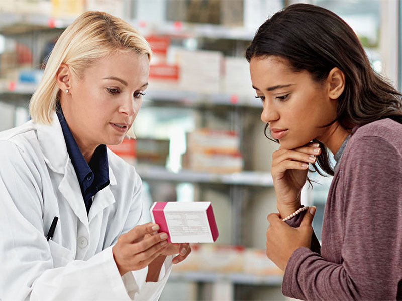 pharmacist counseling patient on medication