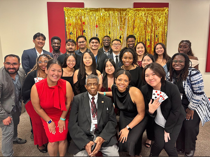 Group photo of Kappa Psi Delta Delta Chapter members and faculty advisor Louis Williams