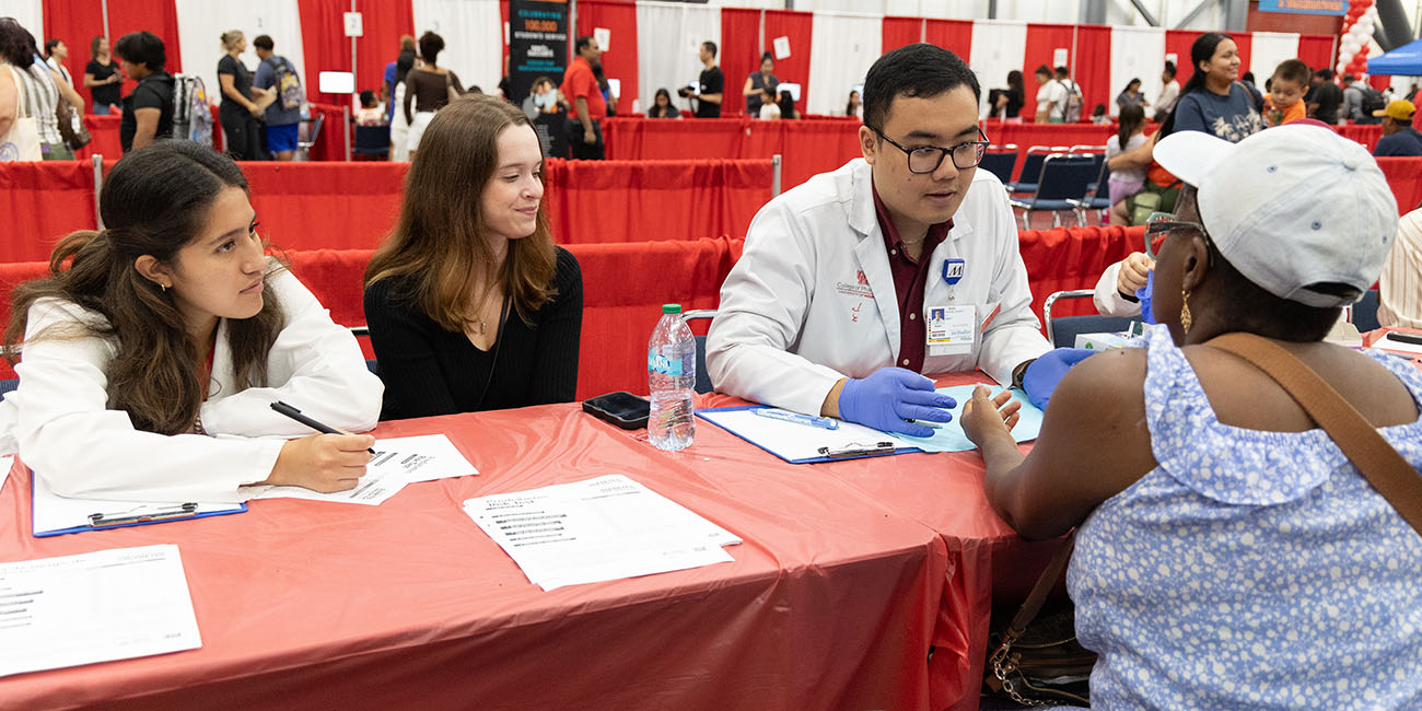 student conducting blood glucose screening