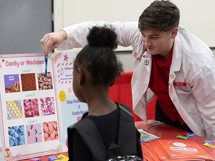 student teaches identification of candy vs. medicine