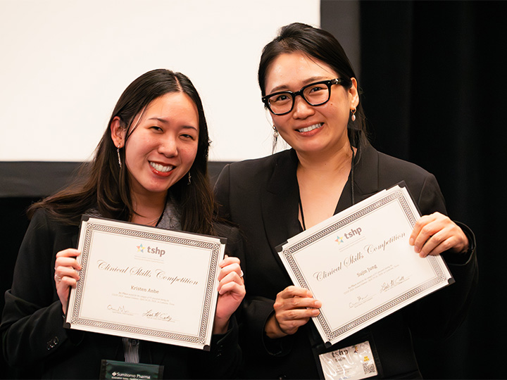 Kristen Anbe and Sujin Jung with their first place certificates at TSHP 2026.