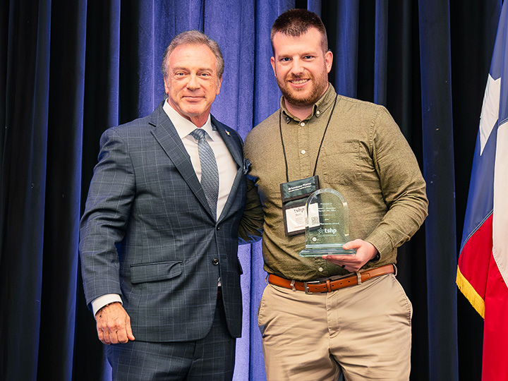Ferrin accepts award from Reich