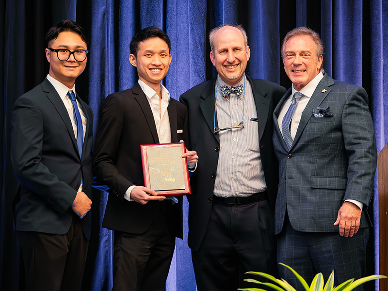 Nguyen, Lim, Wallace and Reich with award