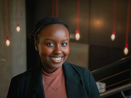 Portrait of a black woman smiling.