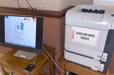 A printer kiosk in a building lobby.