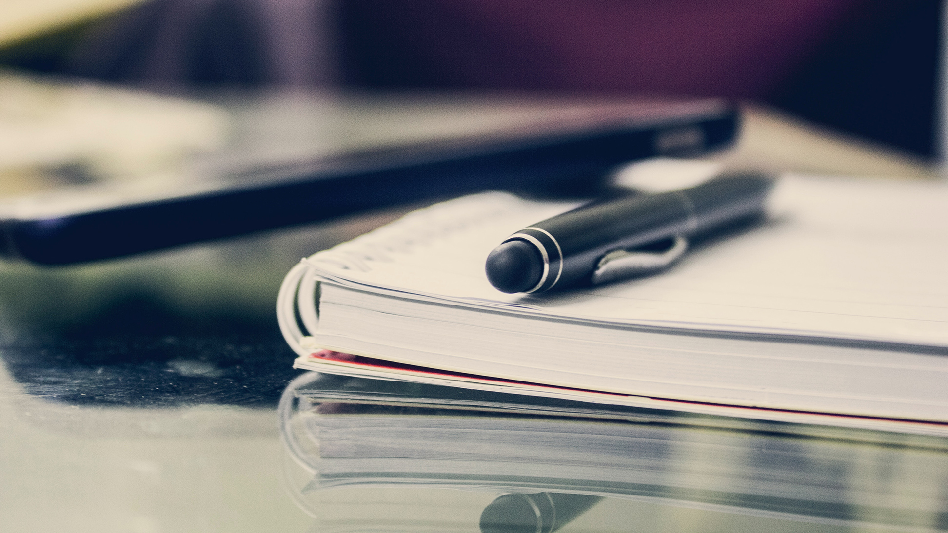 A notepad and pen used for studying.