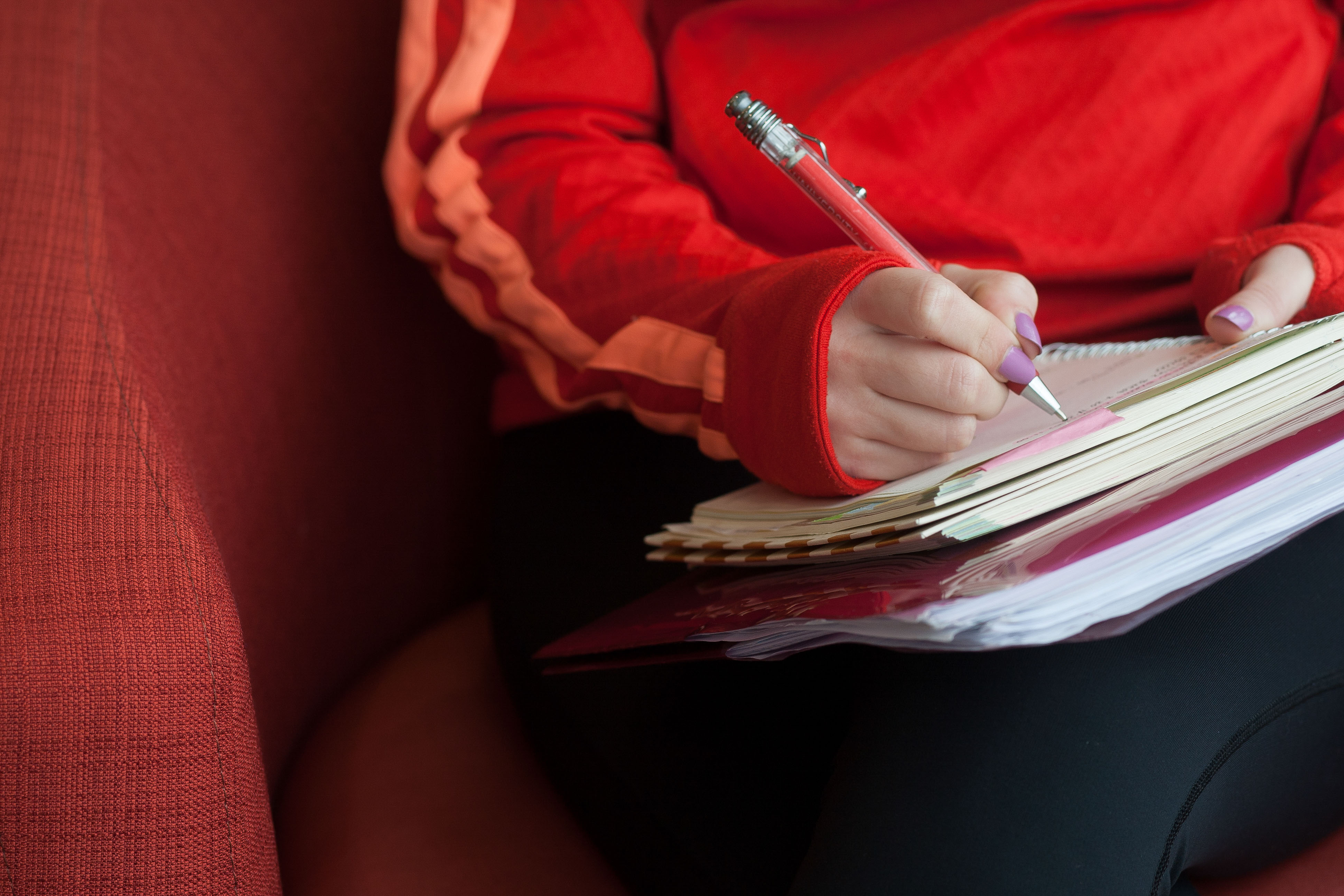 A student writing in her notebook.